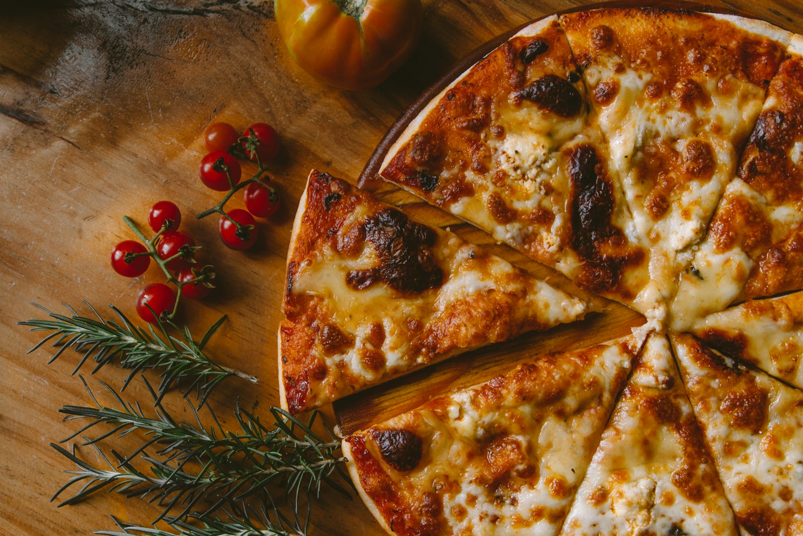 Fresh-baked pizza on a wooden board